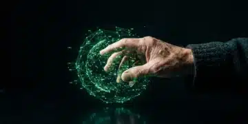 An older man's hand interacts with a glowing green holographic data projection above a dark obsidian desk, illustrating the shift to spatial computing.